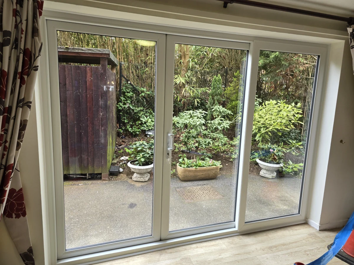 white 3 pane patio door viewed from inside