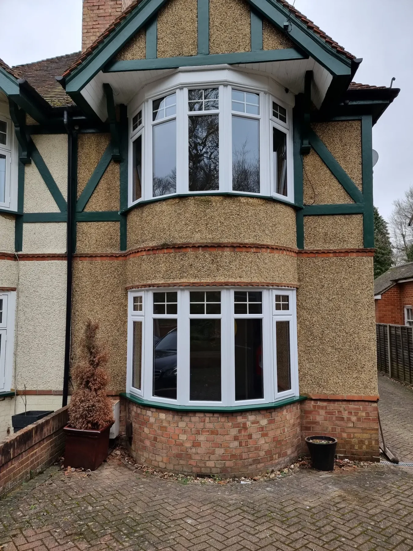 white bow bay windows in 1950's house