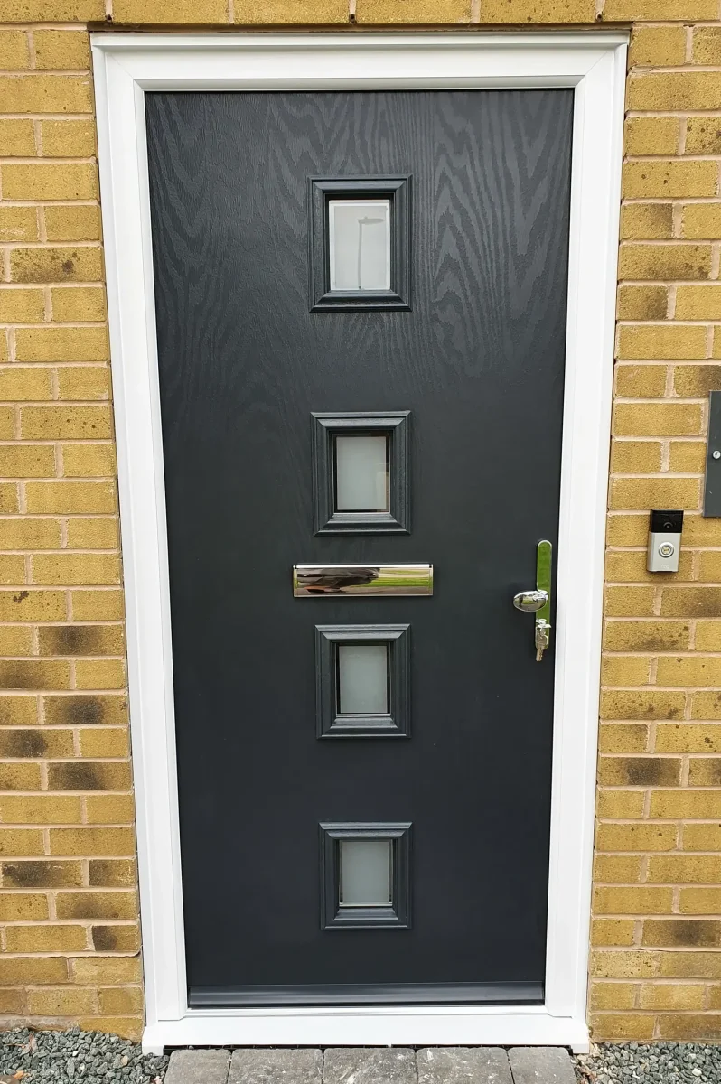 antracite grey corvus composite door in brick wall in hampshire