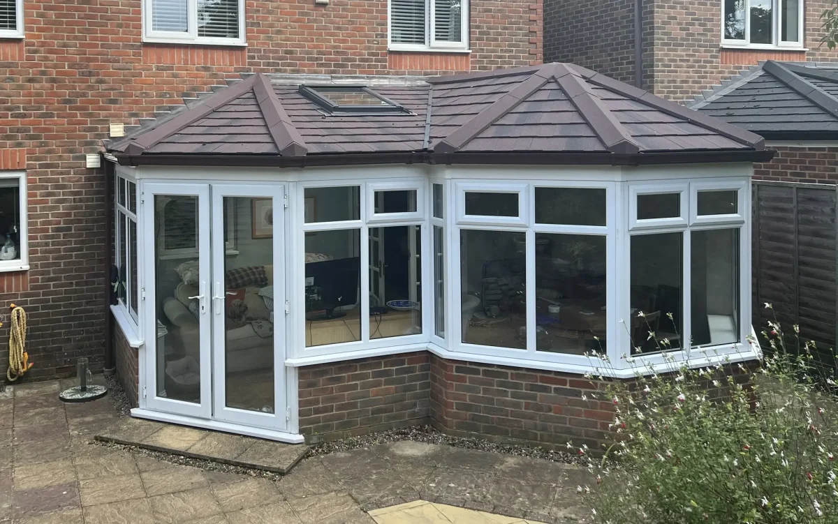 combination solid roof with white french doors