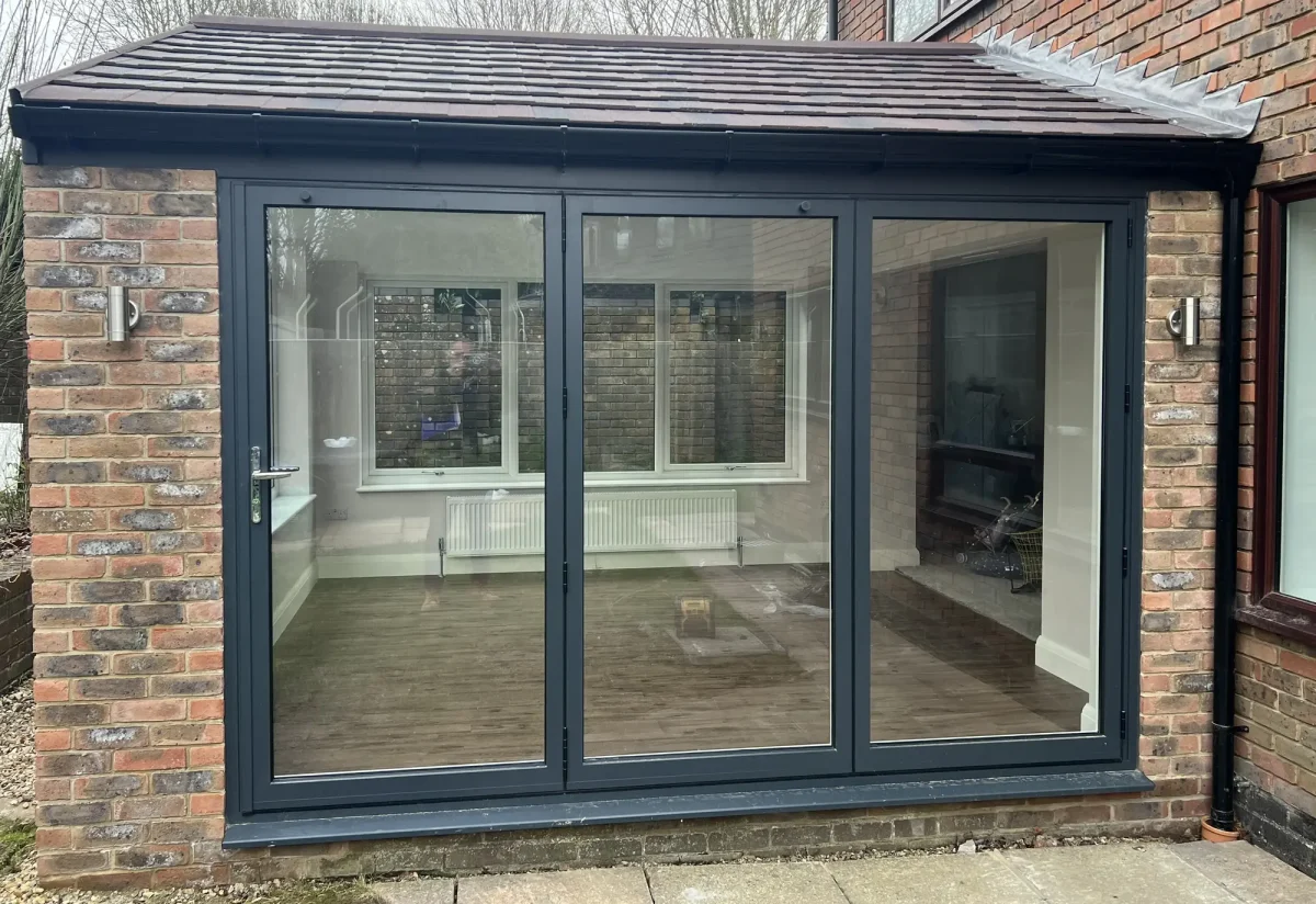 regency guardian roof with grey bifold doors