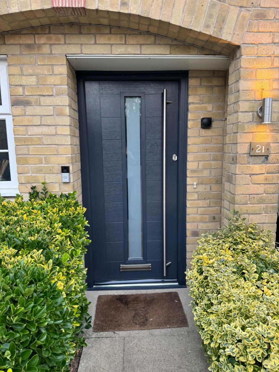 Grey halley composite door in pale brickwork