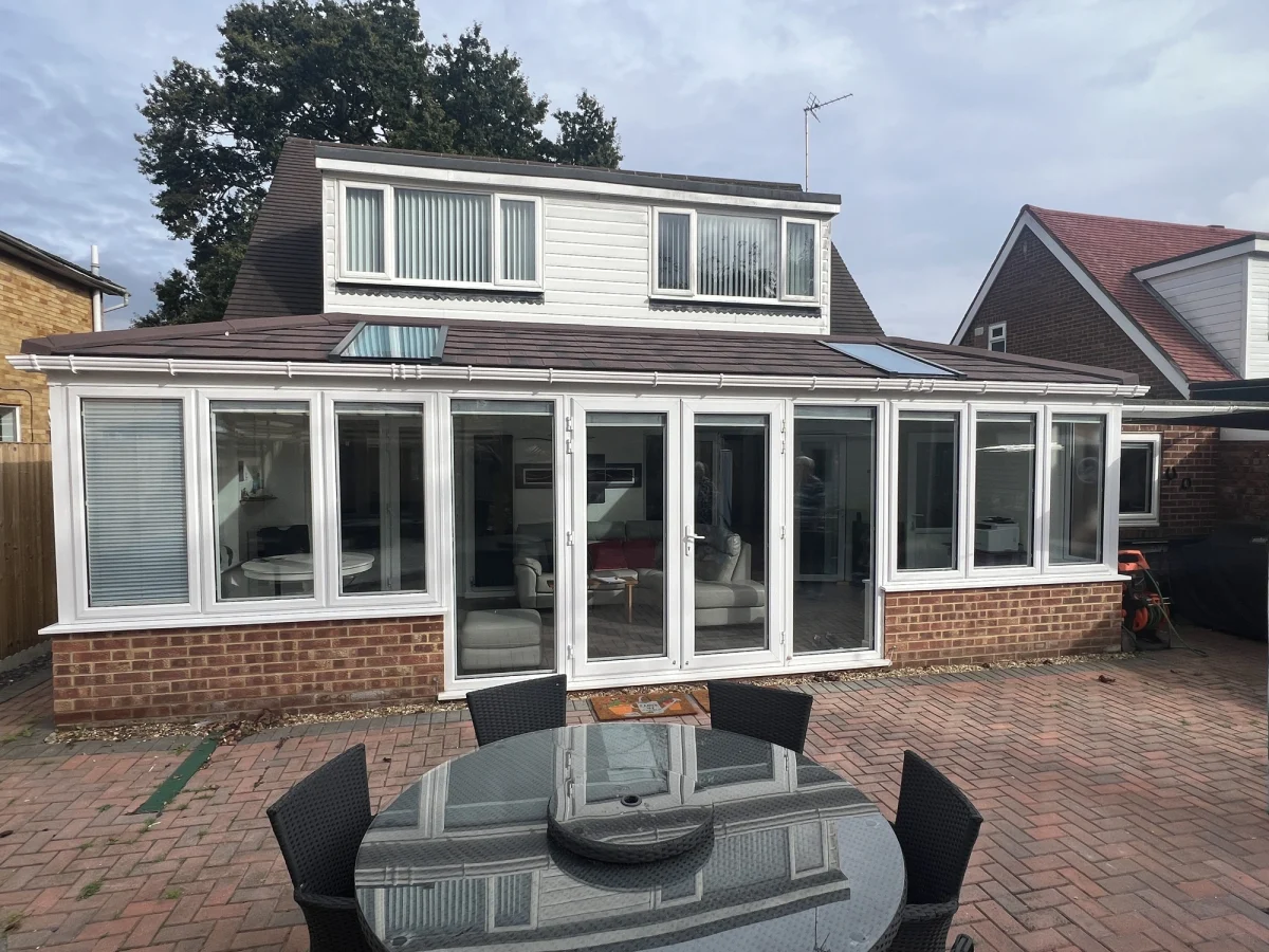 hipped lean to guardian conservatory replacement roof viewed from outside with solstice units