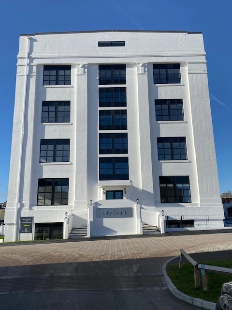 black aluminium windows in side of white painted building