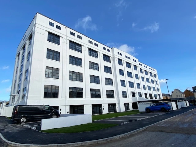 black aluminium windows in white painted building