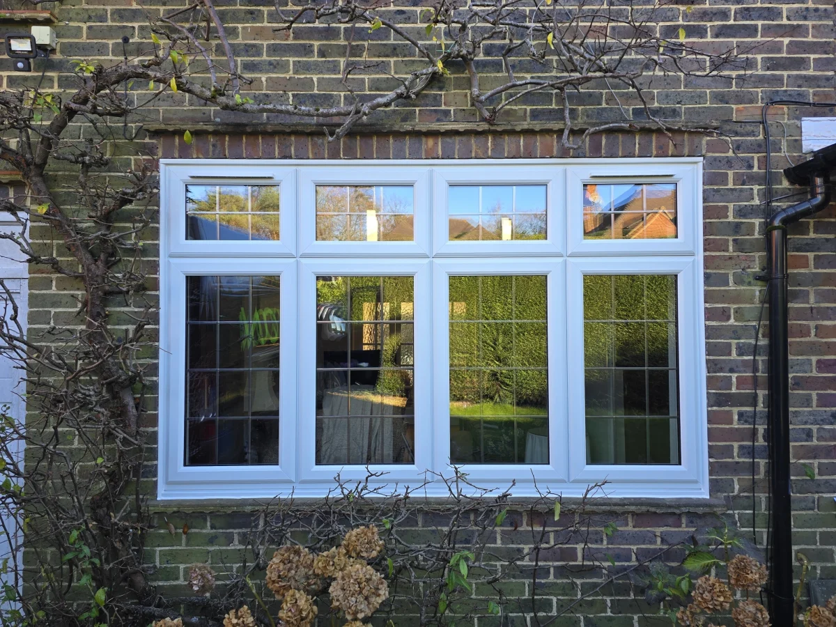 casement window with square lead in brick wall