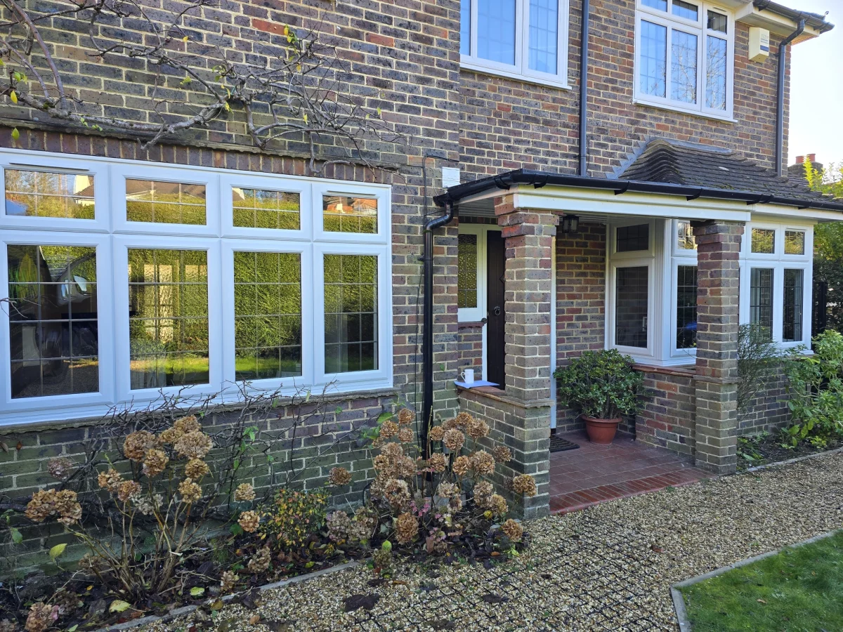 casement windows with square lead in brick wall