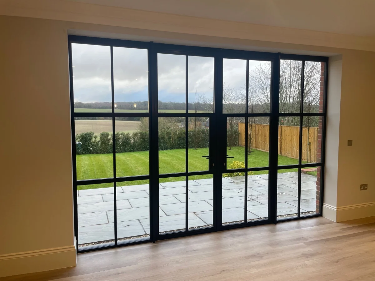 black aluminium french doors opening onto patio